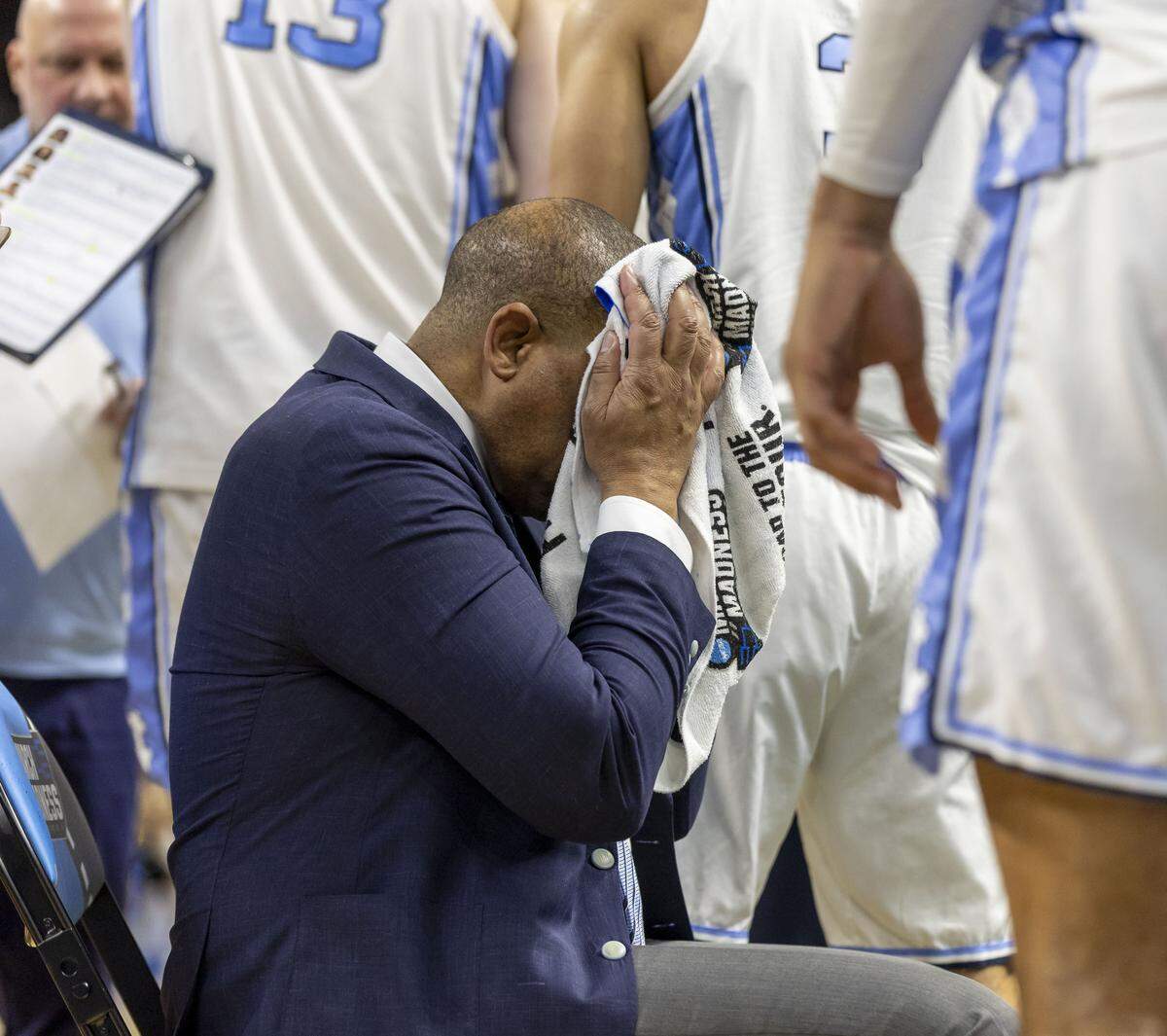 North Carolina coach Hubert Davis wipes his face after huddling with his team during a time out in the second half against VCU on Thursday, March 18, 2026, during the first round of the NCAA Tournament at Bon Secours Arena in Greenville, S.C.