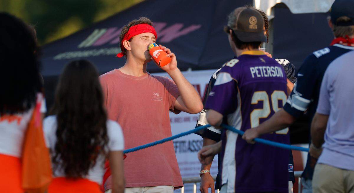 Attendees hang out at “Flagstock 2024,” an invite-only concert featuring country musicians Big & Rich and Lee Greenwood, among others, at a location in Chapel Hill, N.C., Monday, Sept. 2, 2024. Flagstock started after a GoFundMe raised over $500,000 for a “rager” for UNC-Chapel Hill fraternity brothers who held up the American flag during an April campus protest.