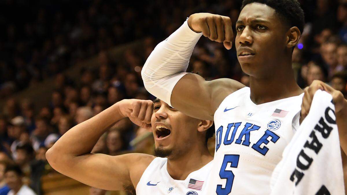 Duke guard Tre Jones (3) and forward RJ Barrett (5) react after a teammate scores in the second half. Duke defeated Stetson 113-49 at Cameron Indoor Stadium In Durham, N.C. Saturday, Dec. 1, 2018.