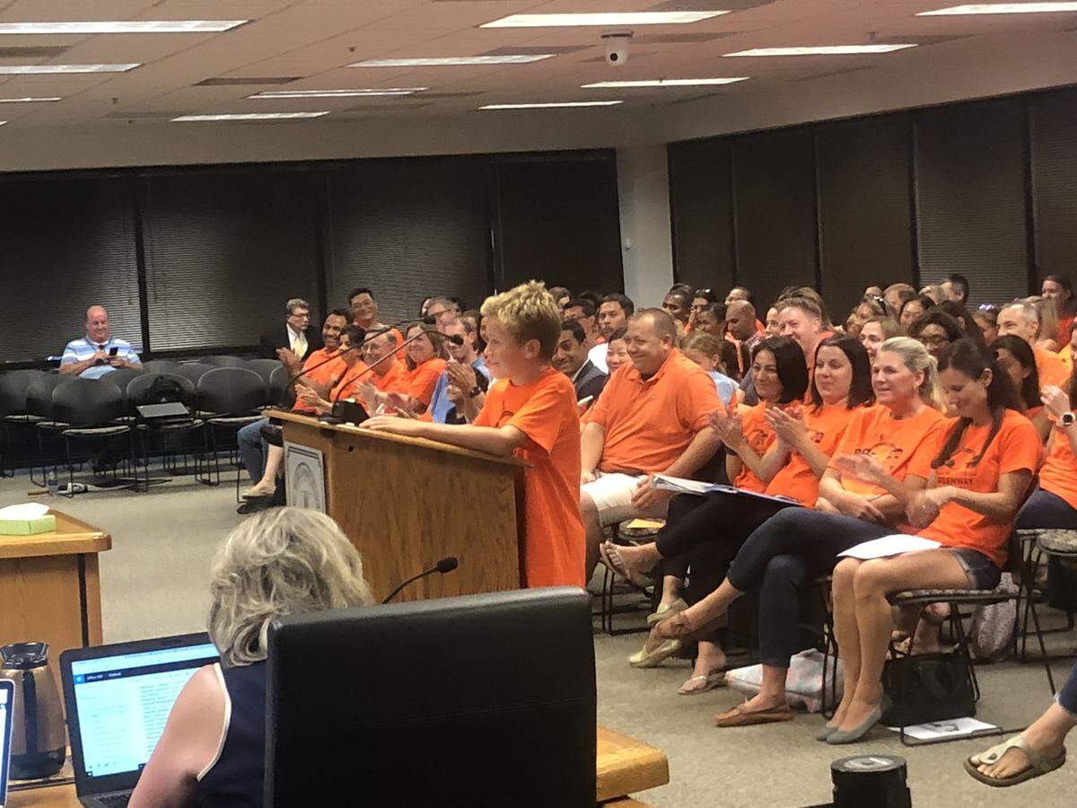 Carter Brady, a fifth-grade student at Mills Park Elementary School, urges the Wake County school board on Sept. 4, 2018 in Cary, N.C., not to move his neighborhood to different schools for the 2019-20 school year.