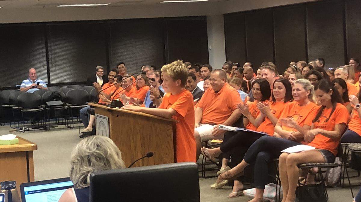 Carter Brady, a fifth-grade student at Mills Park Elementary School, urges the Wake County school board on Sept. 4, 2018 in Cary, N.C., not to move his neighborhood to different schools for the 2019-20 school year.