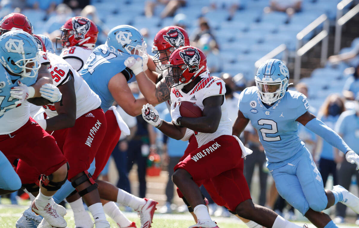 N.C. State running back Zonovan ‘Bam’ Knight (7) runs during the first half of N.C. State’s game against UNC at Kenan Stadium in Chapel Hill, N.C., Saturday, Oct. 24, 2020.