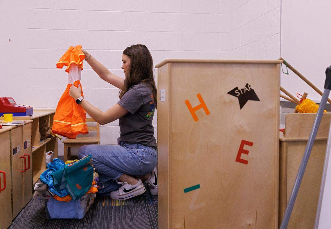 Emily Brugler, a first-year pre-kindergarten teacher, prepares her classroom at South Lakes Elementary School on Thursday, Aug. 22, 2024, in Fuquay-Varina, N.C. Brugler has a traditional teaching degree, unlike many of the new teachers being hired in North Carolina.