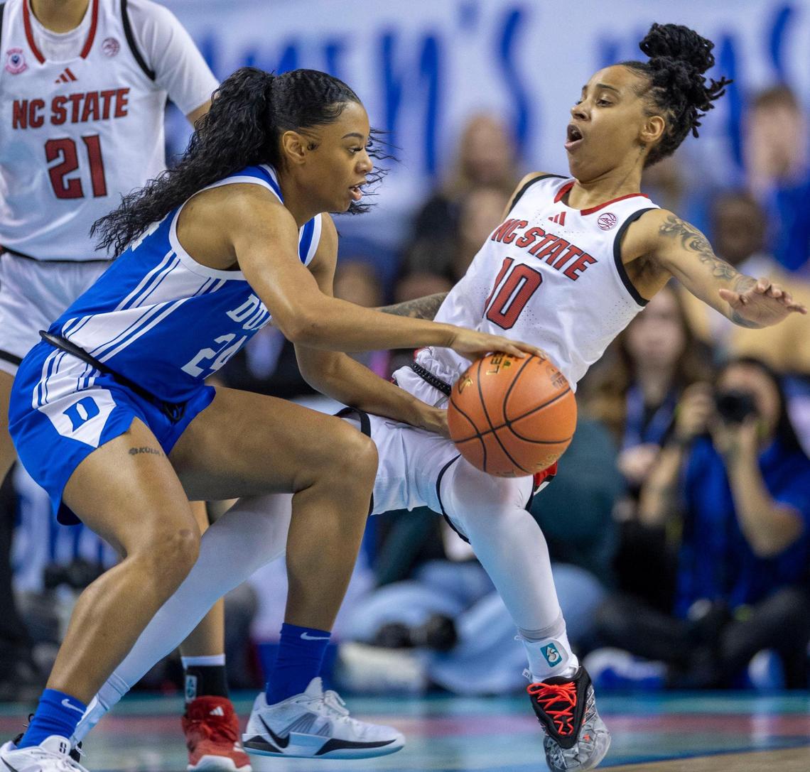 Duke’s Reigan Richardson (24) collides with N.C. State’s Aziaha James (10) in the first quarter during the ACC Championship on Sunday, March 9, 2025 in Greensboro, N.C.