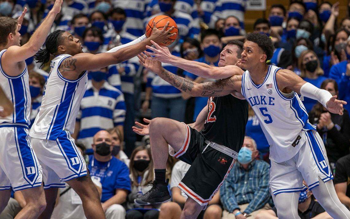 Duke’s Trevor Keels (1) and Paolo Banchero (5) force a turnover by Campbell’s Jesus Carralero (12) in the second half on Saturday, November 13, 2021 at Cameron Indoor Stadium in Durham, N.C.