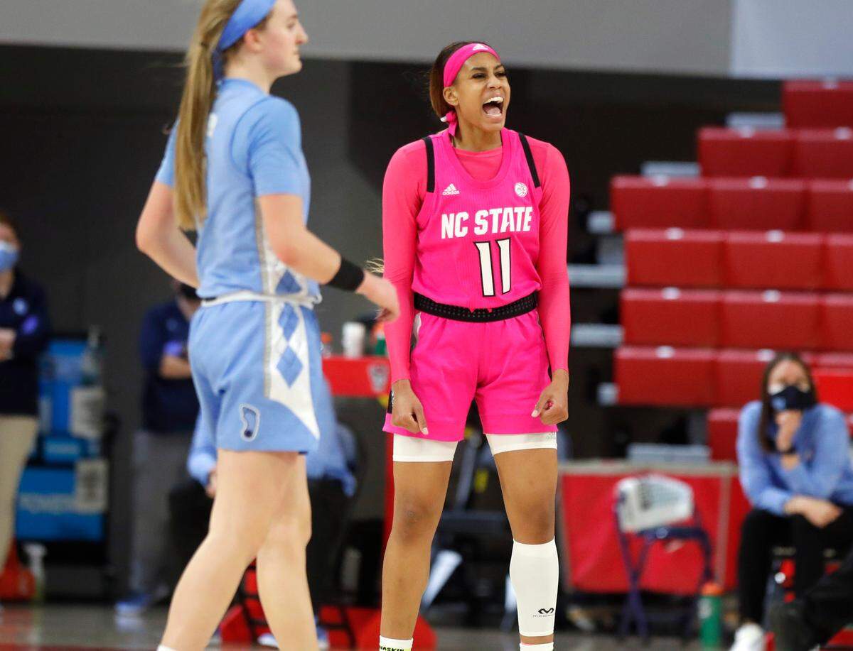 N.C. State’s Jakia Brown-Turner (11) celebrates during the second half of N.C. State’s 82-63 victory over UNC in the annual Play4Kay game at Reynolds Coliseum in Raleigh, N.C., Sunday, February 21, 2021.