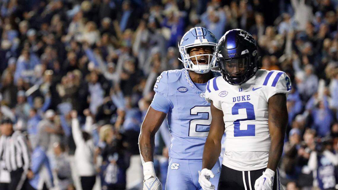 North Carolina’s Don Chapman celebrates in front of Duke’s Sahmir Hagans after the Blue Devils failed to complete a two-point conversion, losing 47-45 in double overtime on Saturday, Nov. 11, 2023, at Kenan Stadium in Chapel Hill, N.C.