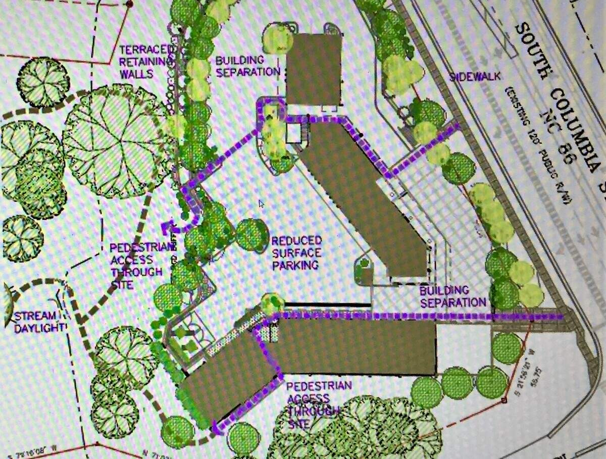 South Columbia Annex would be four stories tall at the street level, with up to 69 parking spaces under and behind the building. The developer is planning to restore a stream and preserve up to 60% of the woods on the site.
