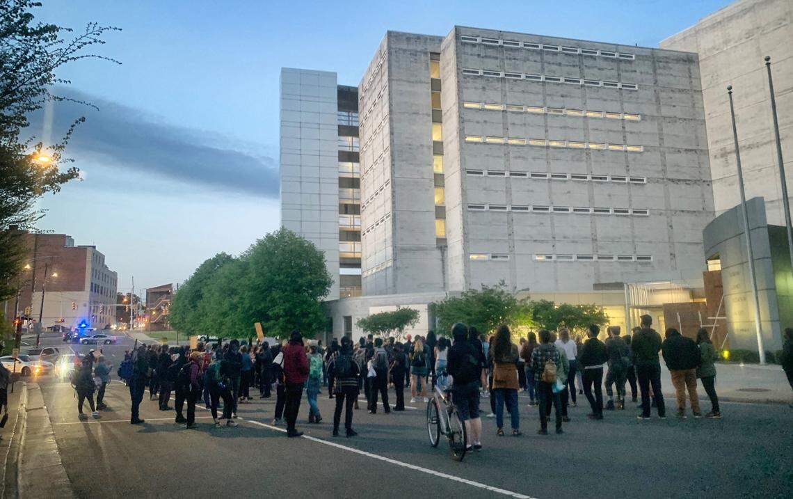 Over 100 demonstrators rally and chant outside the Durham County Detention Facility in downtown Durham, N.C., Friday evening, April 16, 2021.