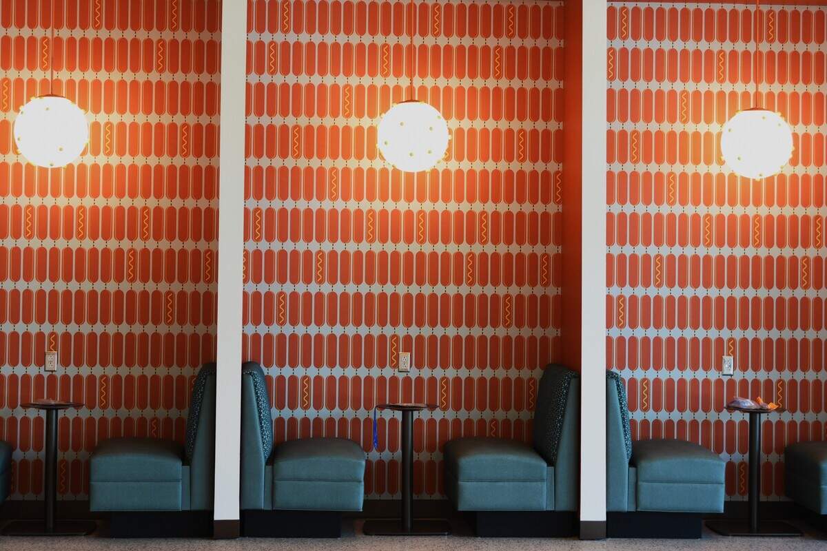 Fitting for a food hall at the fairgrounds, the Midway Event Center opens with hot dog wallpaper.
