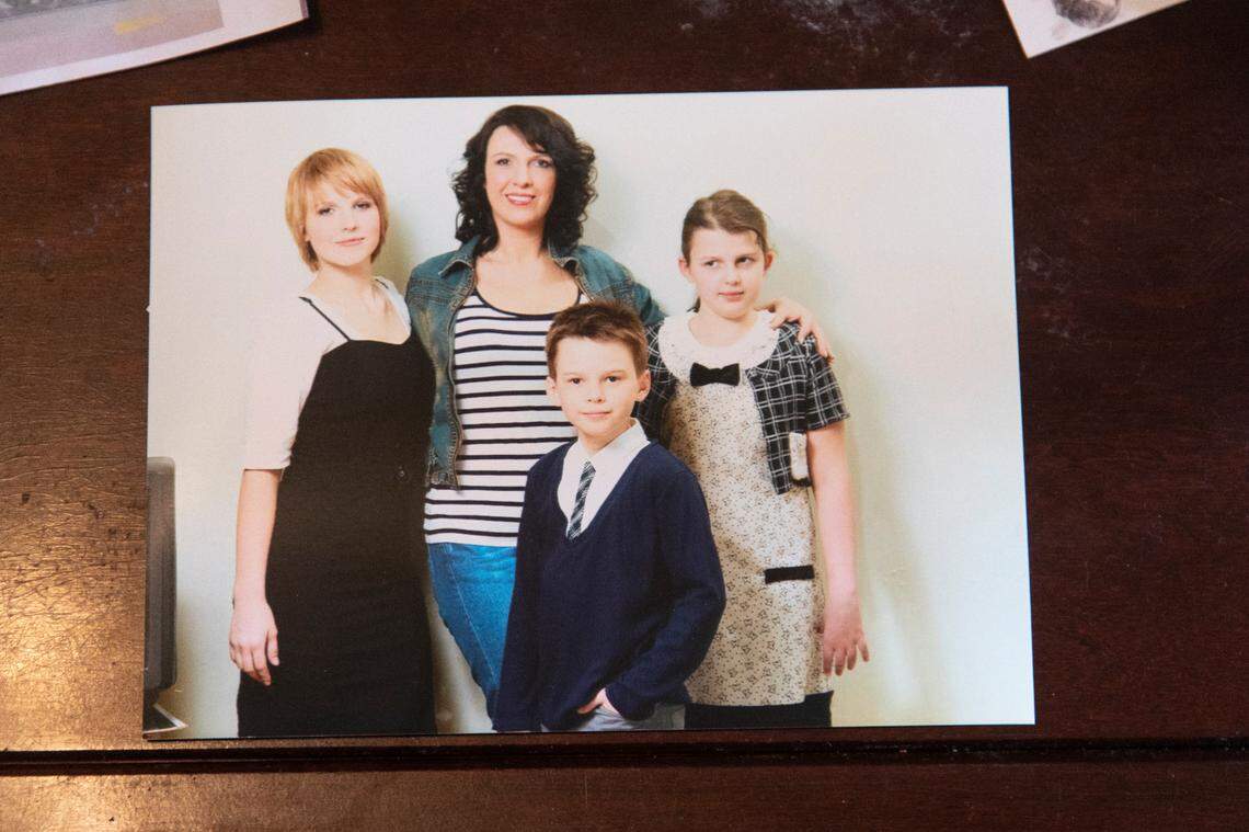 Tatiana Saenko, center, an ethnic Ukrainian from Russia, with her three children several years ago. Saenko, now a permanent resident in the U.S., is particularly worried about her son, Anthony, who will turn 18 soon and be conscripted into the Russian army.