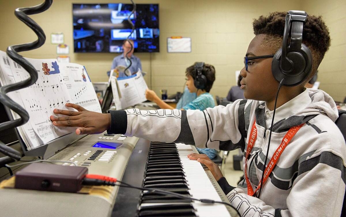 Noah Hasan, 11, during music class at Moore Square Magnet Middle School in Raleigh, NC on July 30, 2019.