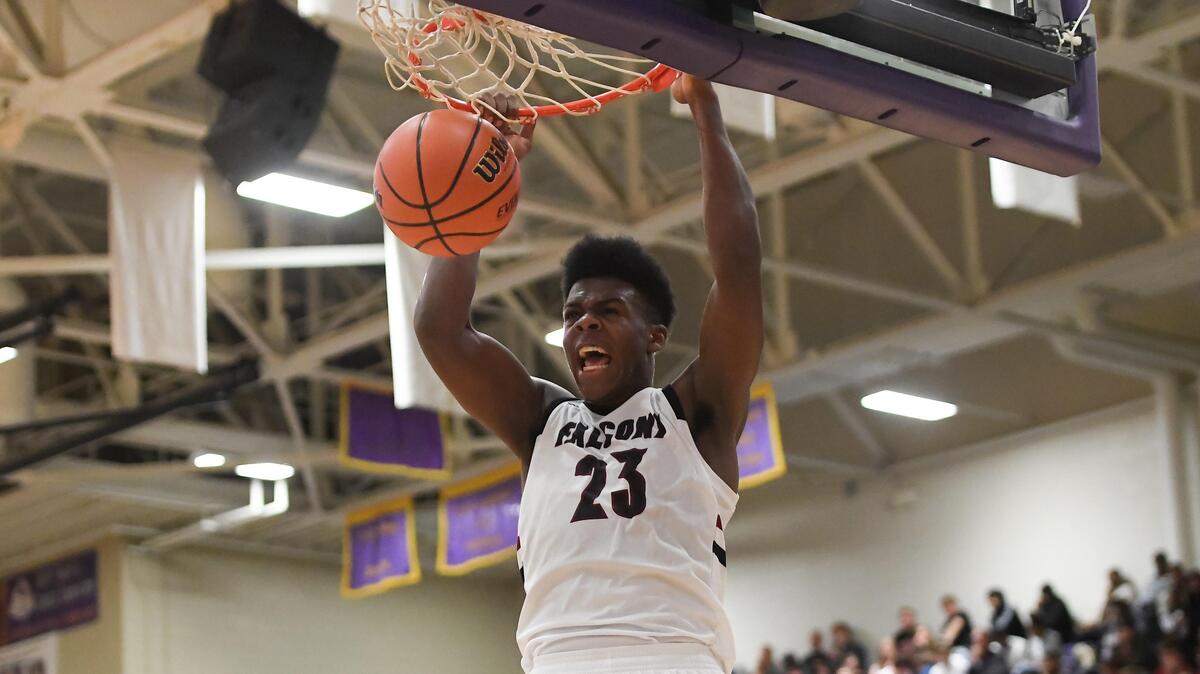 Day’ron Sharpe (23) of South Central dunks for two points. The South Central Falcons played the Athens Drive Jaguars in high school basketball game that was part of the John Wall Holiday Invitational Tournament in Raleigh, N.C. on December 26, 2018.