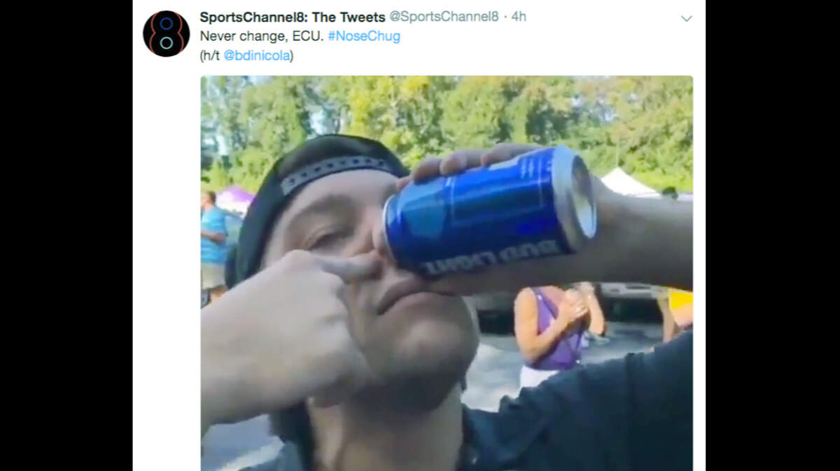 A screenshot of a video apparently showing an ECU fan chugging a beer through his nose.
