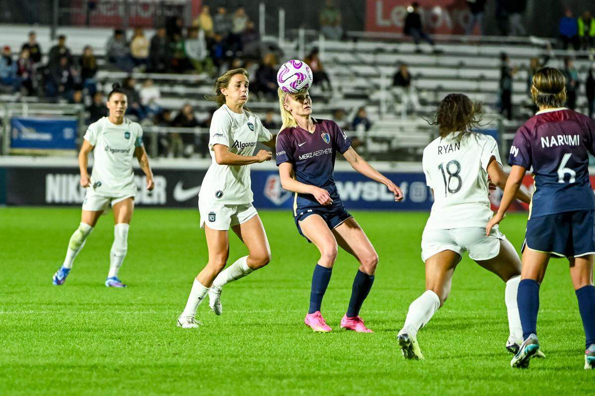 NC Courage forward Tyler Lussi (14) heads the ball during the first half of a playoff match against Gotham FC at WakeMed Soccer Park in Cary, NC, on Sunday, Oct. 22, 2023.