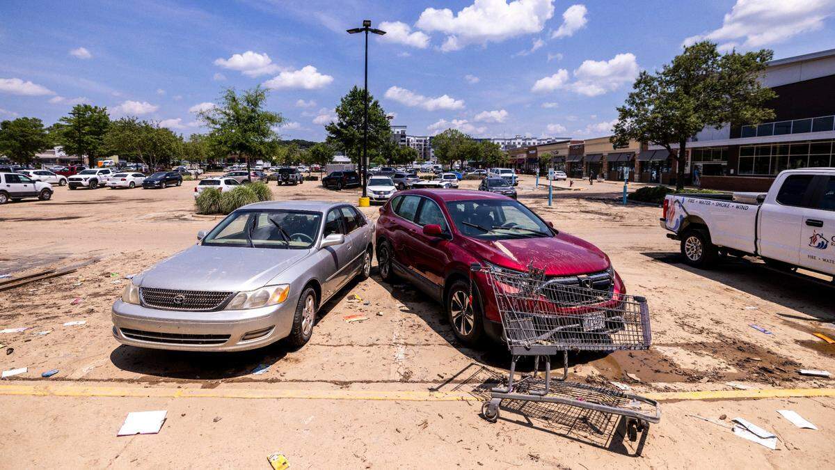 Vehicles were lifted from their parking spots at Eastgate Crossing in Chapel Hill on Monday, July 7, 2025, after floodwaters surged about 5 feet inside and around businesses at the shopping center. The flooding was caused by heavy rain from Tropical Storm Chantal, which triggered flash flooding in parts of Orange, Durham, and Chatham counties.