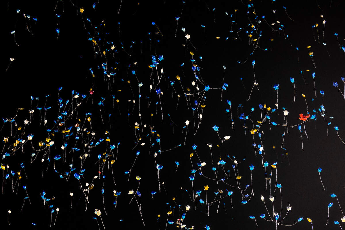Balloons drift into the night sky after mourners released the balloons at the conclusion of a vigil Wednesday, Jan. 24, 2024 on the track of Charles T. Tucker Stadium at Smithfield-Selma High School in Johnston County. Five Smithfield-Selma students were memorialized including four boys who died in a car wreck early Monday morning.