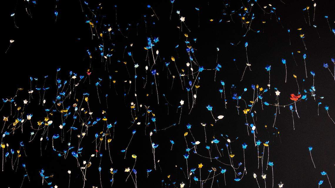 Balloons drift into the night sky after mourners released them at the conclusion of a vigil memorializing five students from Smithfield-Selma High School in January 2024. While balloon releases can be beautiful and richly symbolic, they can also result in later harm to wildlife.