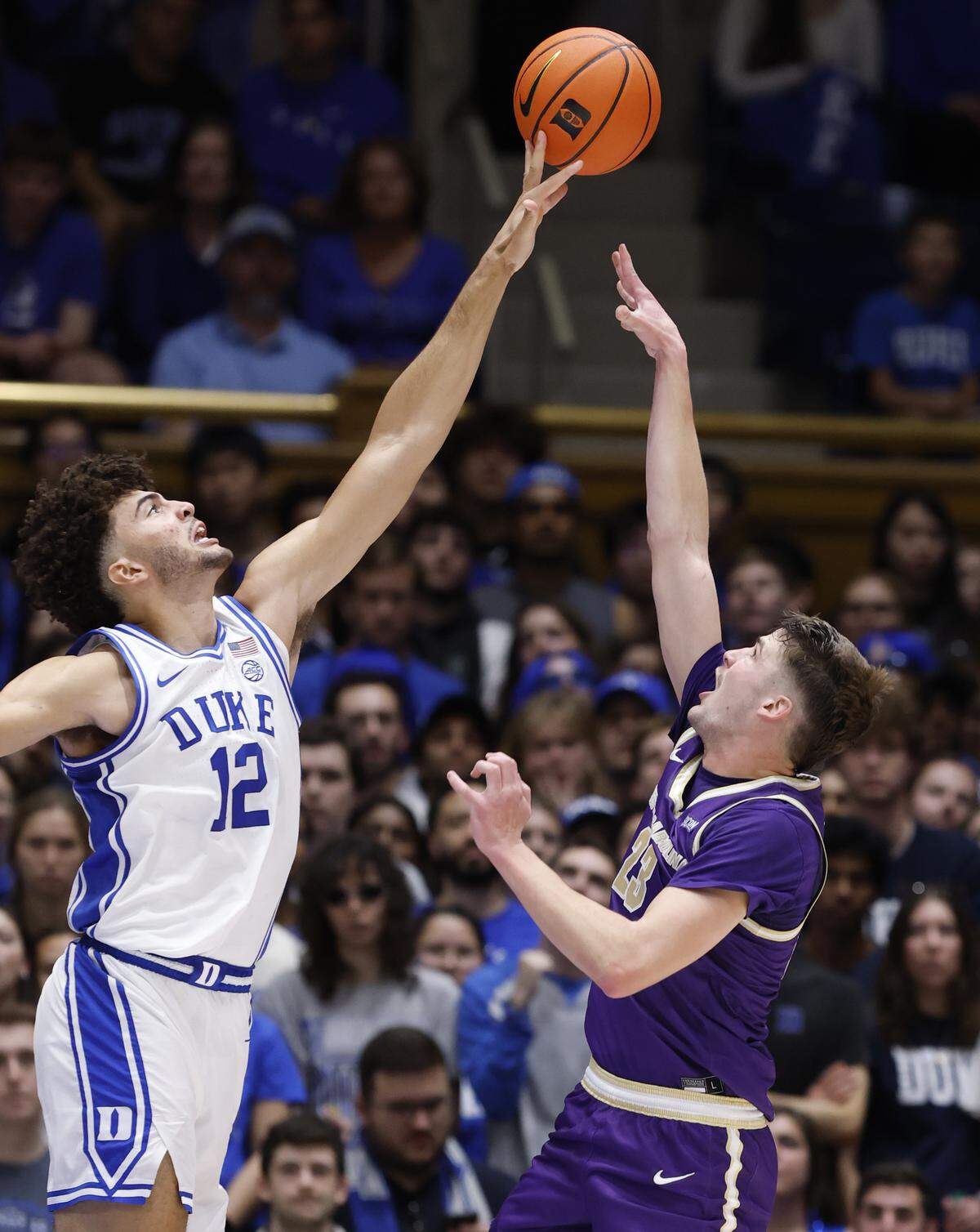 Duke’s Cameron Boozer (12) blocks the shot by Western Carolina's Marcus Kell (23) during the first half of Duke’s game against Western Carolina at Cameron Indoor Stadium in Durham, N.C., Saturday, Nov. 8, 2025.