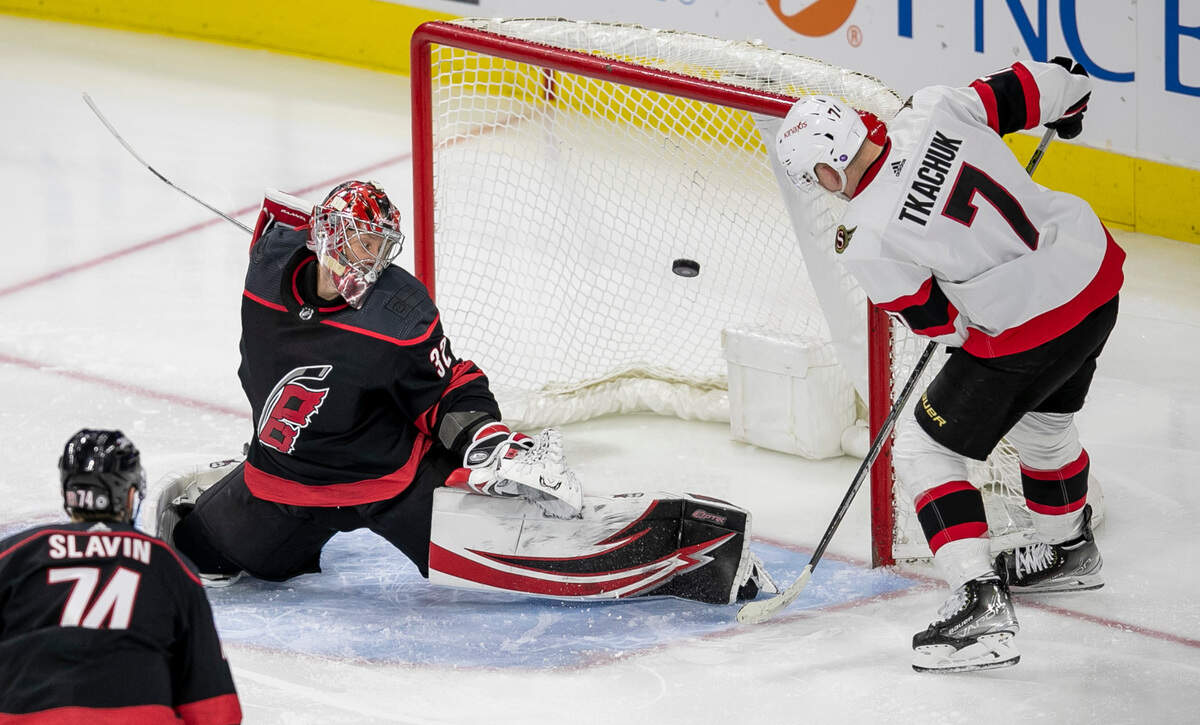 Ottawa’s Brady Tkachuk (35) scores on Carolina Hurricanes’ goalie Antii Raanta (32) to tie the score 2-2 in the third period on Tuesday, April 4, 2023 at PNC Arena in Raleigh, N.C.