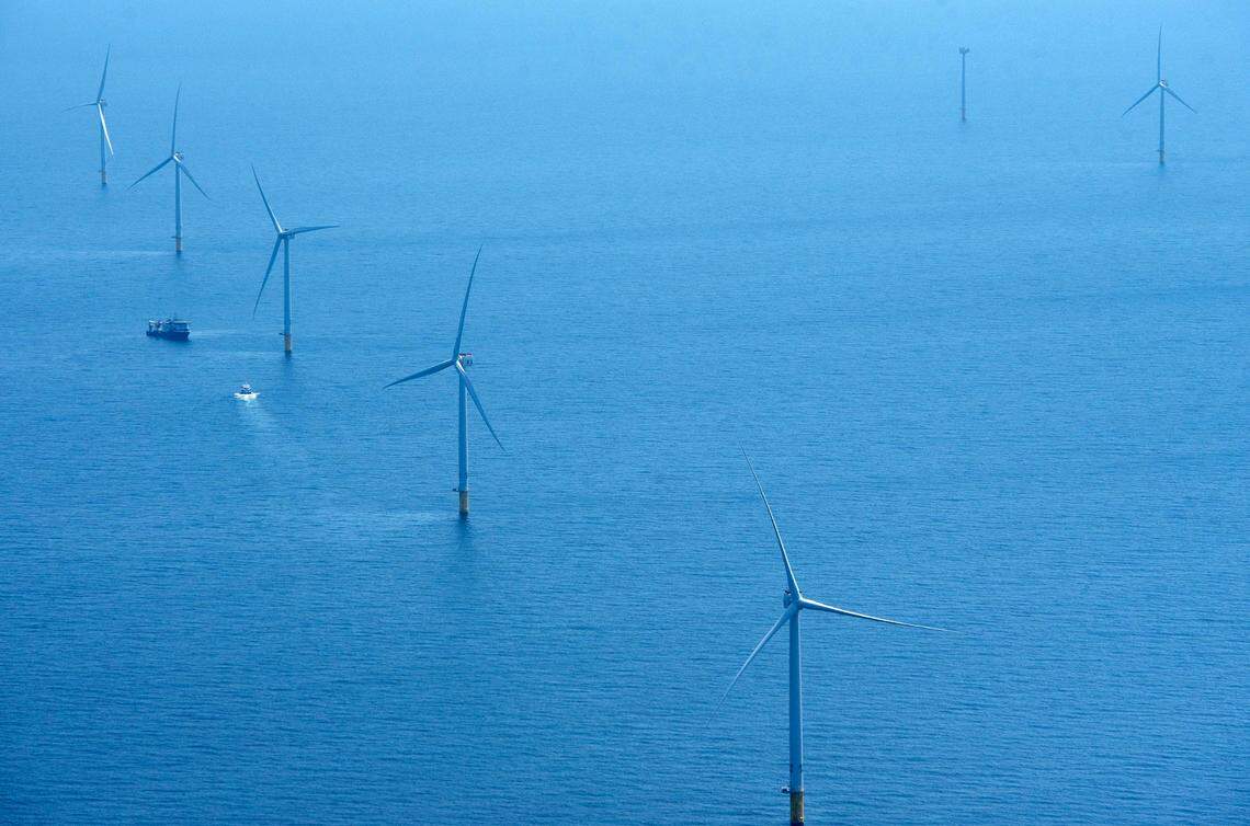 Work boats move between turbines under construction in the Vineyard Wind project, 12 miles south of Martha’s Vineyard in April 2024. Projects that do not have all of their permits, like those off of North Carolina’s coast, will be paused under an executive order signed by President Donald Trump.