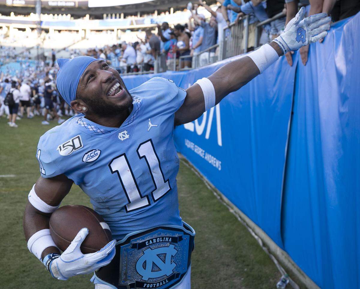 North Carolina’s Myles Wolfolk (11) celebrates the Tar Heels’ 24-20 victory over South Carolina on Saturday, August 31, 2019 at Bank of America Stadium in Charlotte, N.C. Wolfolk had two interceptions in the last thee minutes of the fourth quarter to help seal the Tar Heels’ victory.