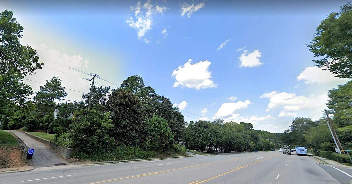 The four lots that comprise The Flats property at 607-617 Martin Luther King Jr. Blvd. in Chapel Hill are now mostly wooded with small homes and a modest apartment building.