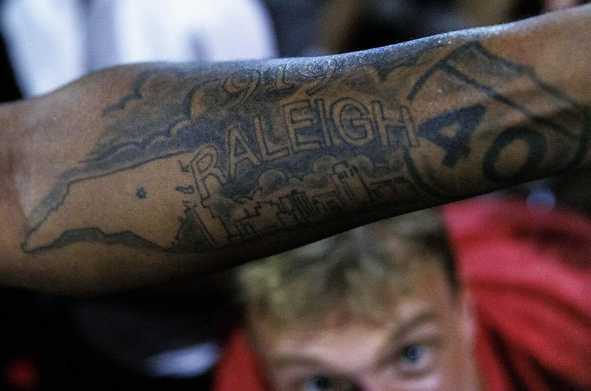 A man showed his Raleigh I-40 tattoo as fans celebrated in the streets after the Carolina Hurricanes won their second Stanley Cup in Glenwood South District on June 14, 2026, in Raleigh, North Carolina. The Hurricanes last won the Stanley Cup in 2006.