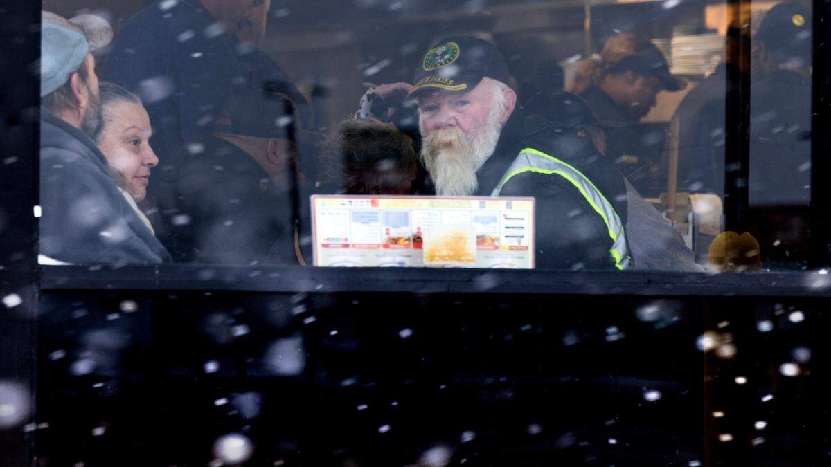 Diners at the Waffle House in Kenly watch the snow fall mid-morning in Johnston County.