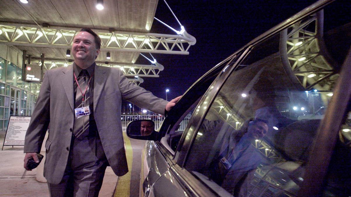 PNC Arena VP & GM Davin Olsen talks with members of the Raleigh Police Department outside the arena to check the flow of traffic into the arena’s parking lots, prior to a Neil Diamond concert in March 2002. Olsen died suddenly on Monday, Jan. 31, 2022.