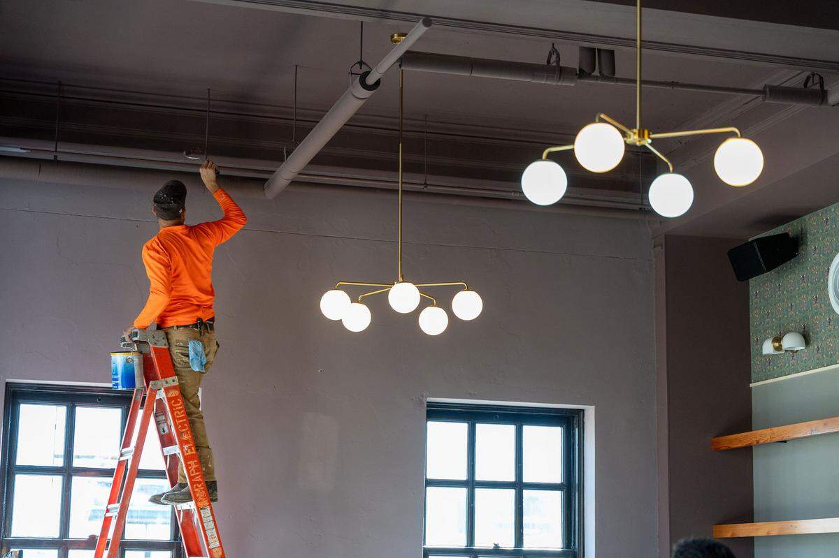 Workers put the finishing touches on the jazz club Missy Lane’s, set to open in Durham on Saturday, January 13, 2024.