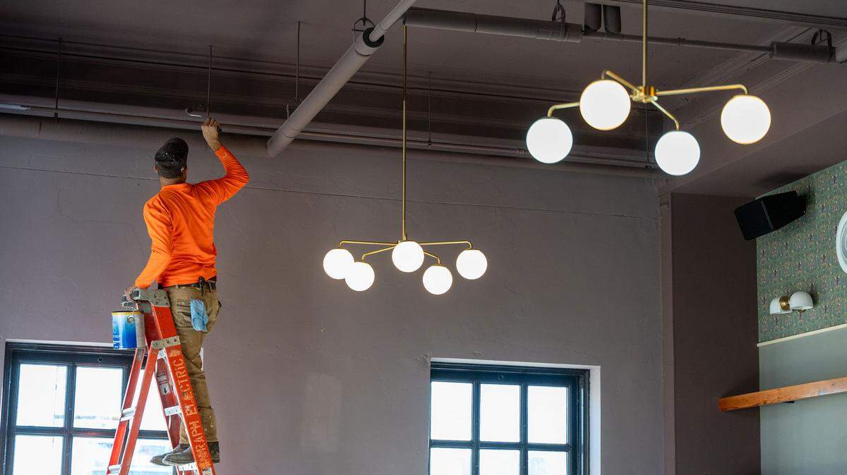 Workers put the finishing touches on the jazz club Missy Lane’s, set to open in Durham on Saturday, January 13, 2024.