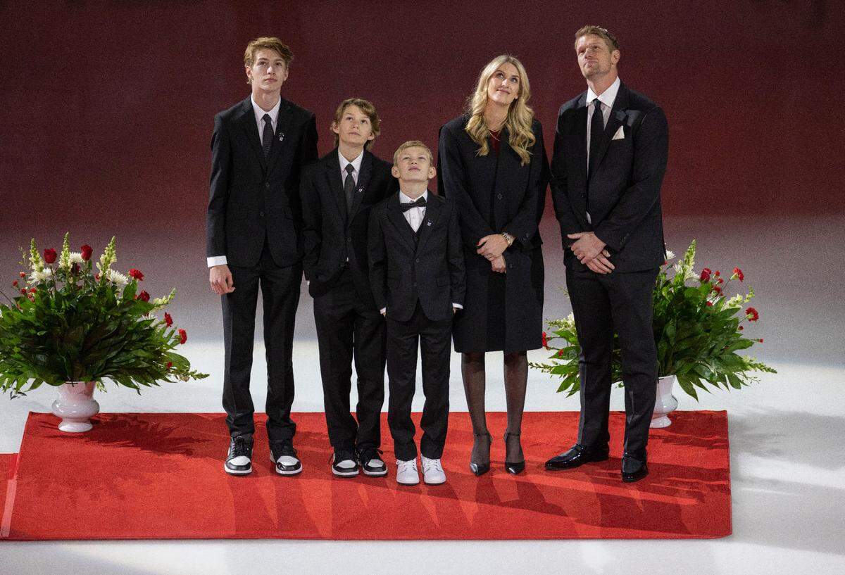From left, Parker, Levi and Finley Staal, Tanya Staal, and former Carolina Hurricanes Captain Eric Staal watche as his jersey is lifted into the rafters during a retirement ceremony on Sunday, January 12, 2025 at Lenovo Center in Raleigh, N.C.