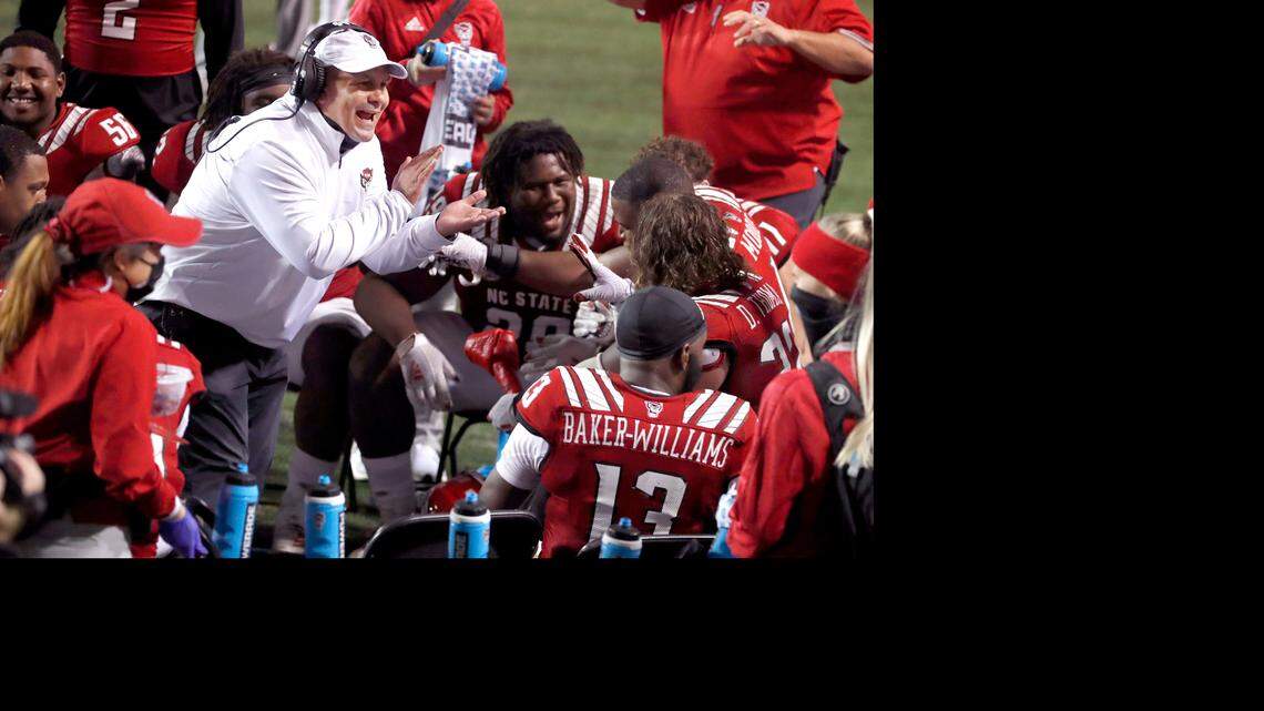 N.C. State defensive coordinator Tony Gibson encourages the defense during the Wolfpack’s 15-14 victory over Liberty at Carter-Finley Stadium in Raleigh, N.C., Saturday, Nov. 21, 2020.