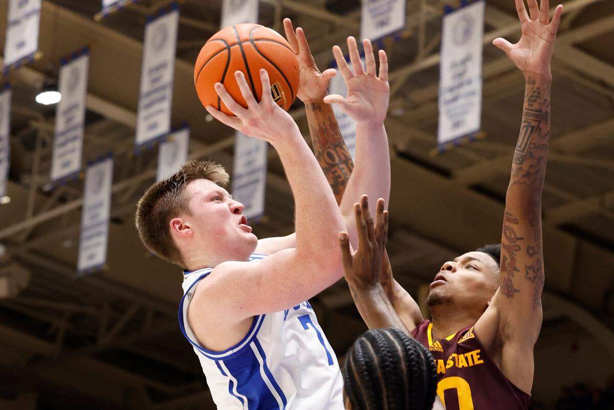 Duke’s Kon Knueppel (7) shoots as Arizona State’s BJ Freeman (10) defends during the first half of Duke’s game against Arizona State in the Brotherhood Run Charity Game at Cameron Indoor Stadium in Durham, N.C., Sunday, Oct. 27, 2024.