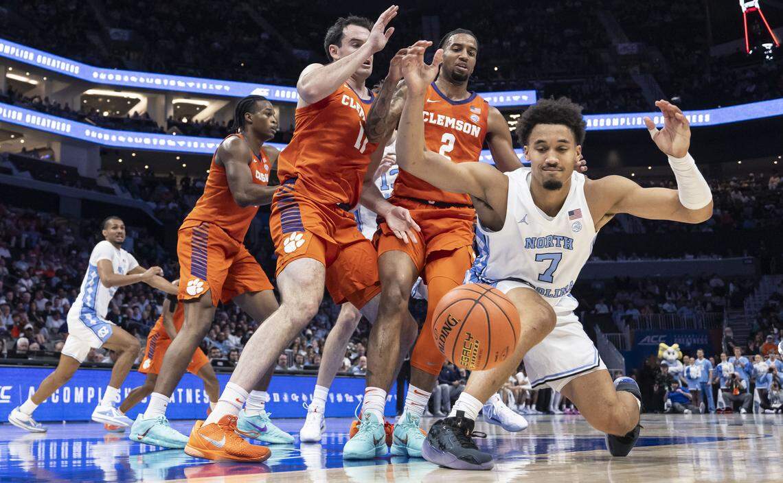 North Carolina guard Seth Trimble (7) fumbles the ball out of bounds under pressure from the Clemson defense in the first half on Thursday, March 12, 2026, during the quarterfinals of the ACC Tournament at Spectrum Center in Charlotte, N.C.