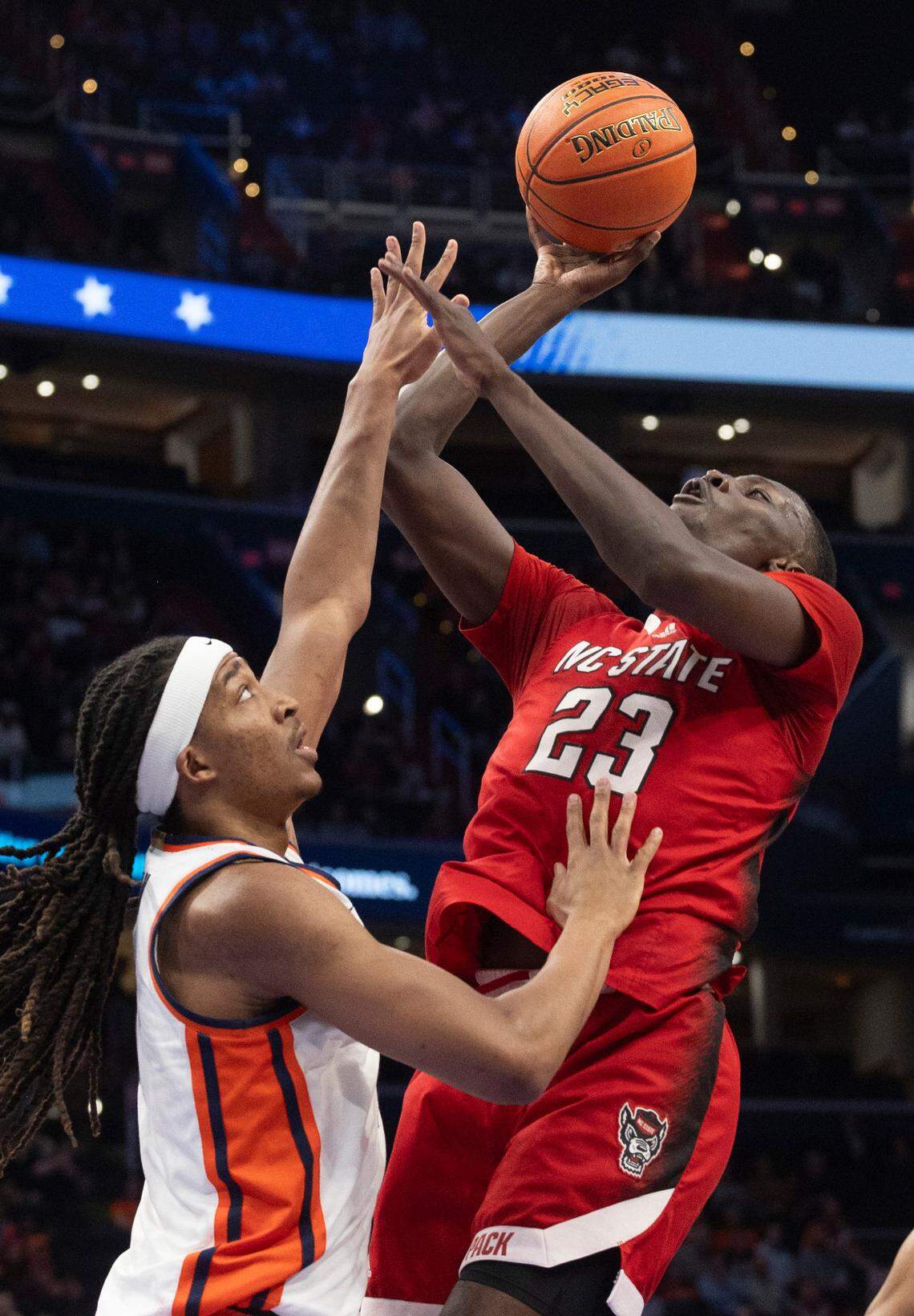 N.C. State’s Mohamed Diarra (23) puts up a shot against Syracuse’s Maliq Brown (1) in the first half during the ACC Men’s Basketball Tournament at Capitol One Arena on Wednesday, March 13, 2024 in Washington, D.C.