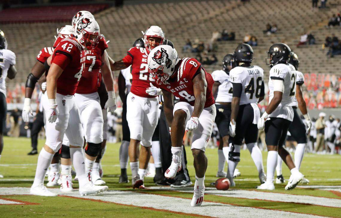 N.C. State running back Ricky Person Jr. (8) celebrates after scoring on a one-yard touchdown run during the first half of N.C. State’s game against Wake Forest at Carter-Finley Stadium in Raleigh, N.C, Saturday, Sept. 19, 2020.