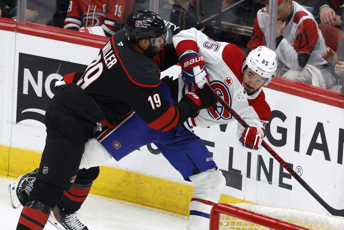 Carolina's K'andre Miller (19) checks Montréal's Alexandre Texier (85) in the first period of the Hurricanes’ game against the Canadiens in game five of the Eastern Conference Finals at the Lenovo Center Friday, May 29, 2026.