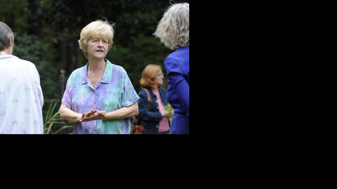 Dale Batchelor talks with visitors during an open house of their certified wildlife garden in Raleigh on Sunday, September 14, 2014.
