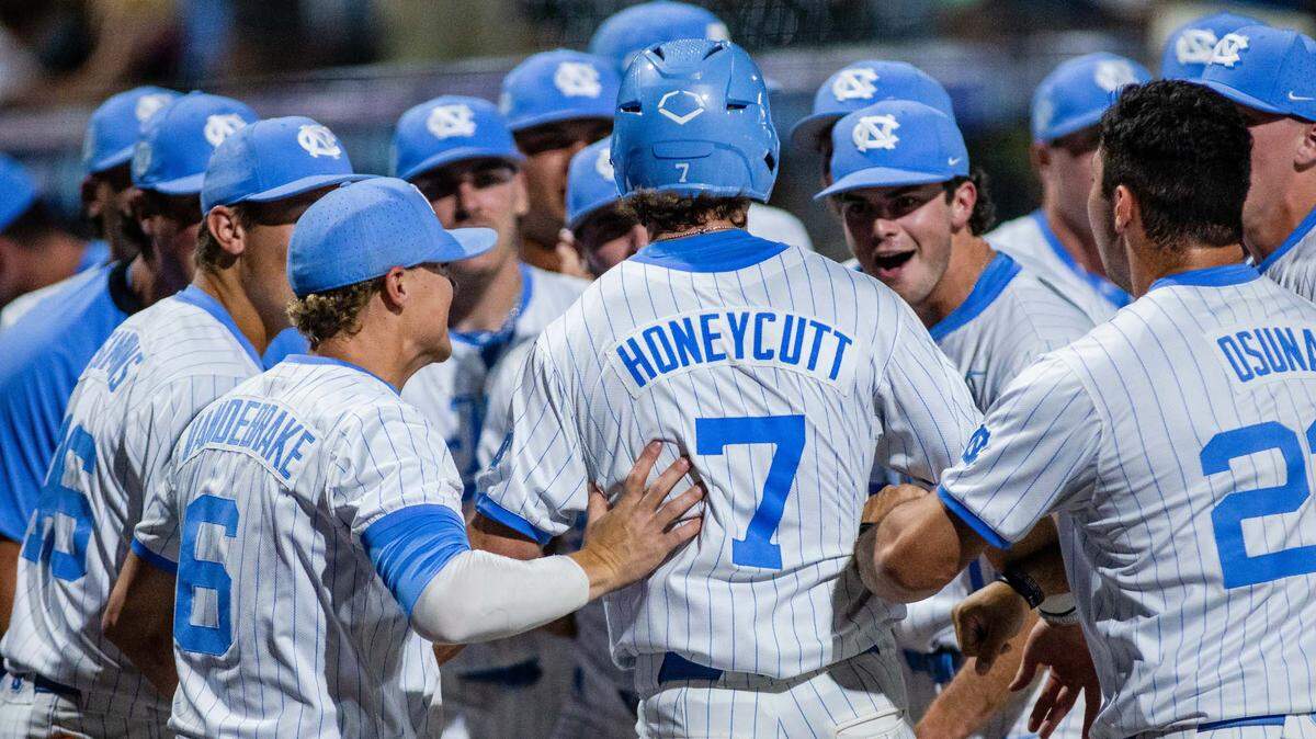 May 24, 2024; Charlotte, NC, USA; North Carolina Tar Heels outfielder Vance Honeycutt (7) celebrates after scoring in the eighth inning against the Wake Forest during the ACC Baseball Tournament at Truist Field.