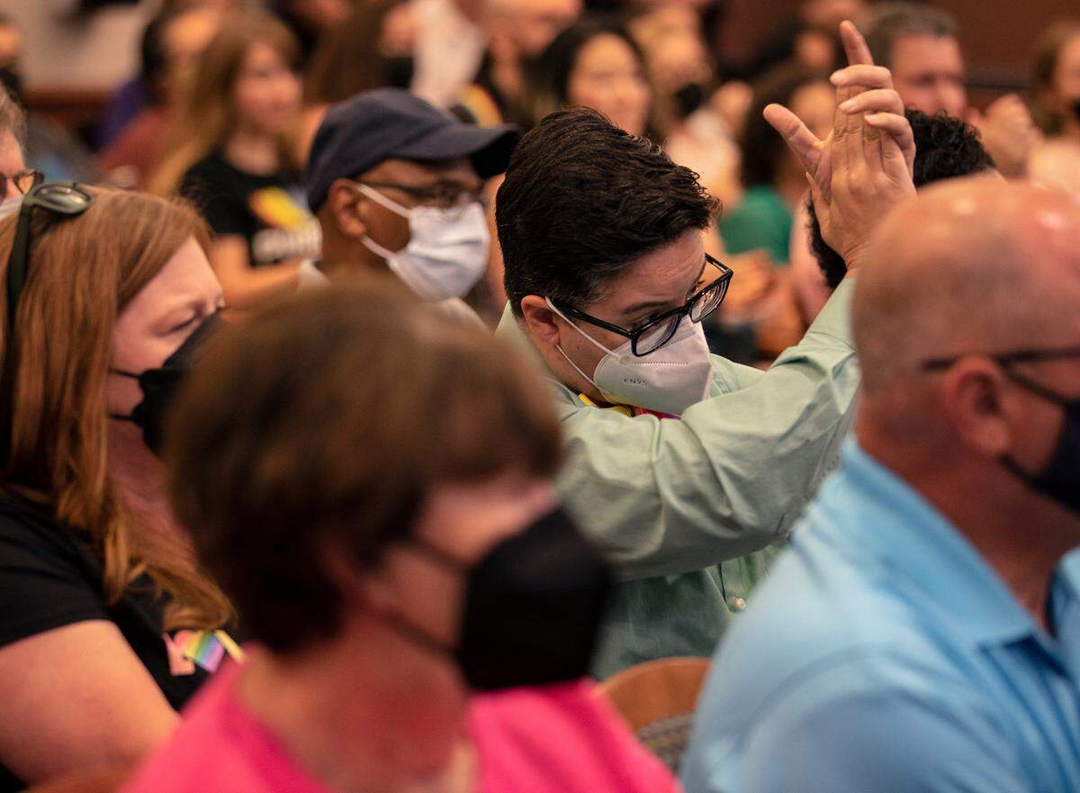 Jackie Turnwald, right, claps following public comments in support of a Pride Month proclamation during a Holly Springs Town Council meeting on Tuesday, June 7, 2022, in Holly Springs, N.C. Requests for the town to issue a proclamation for Pride Month have been unsuccessful.