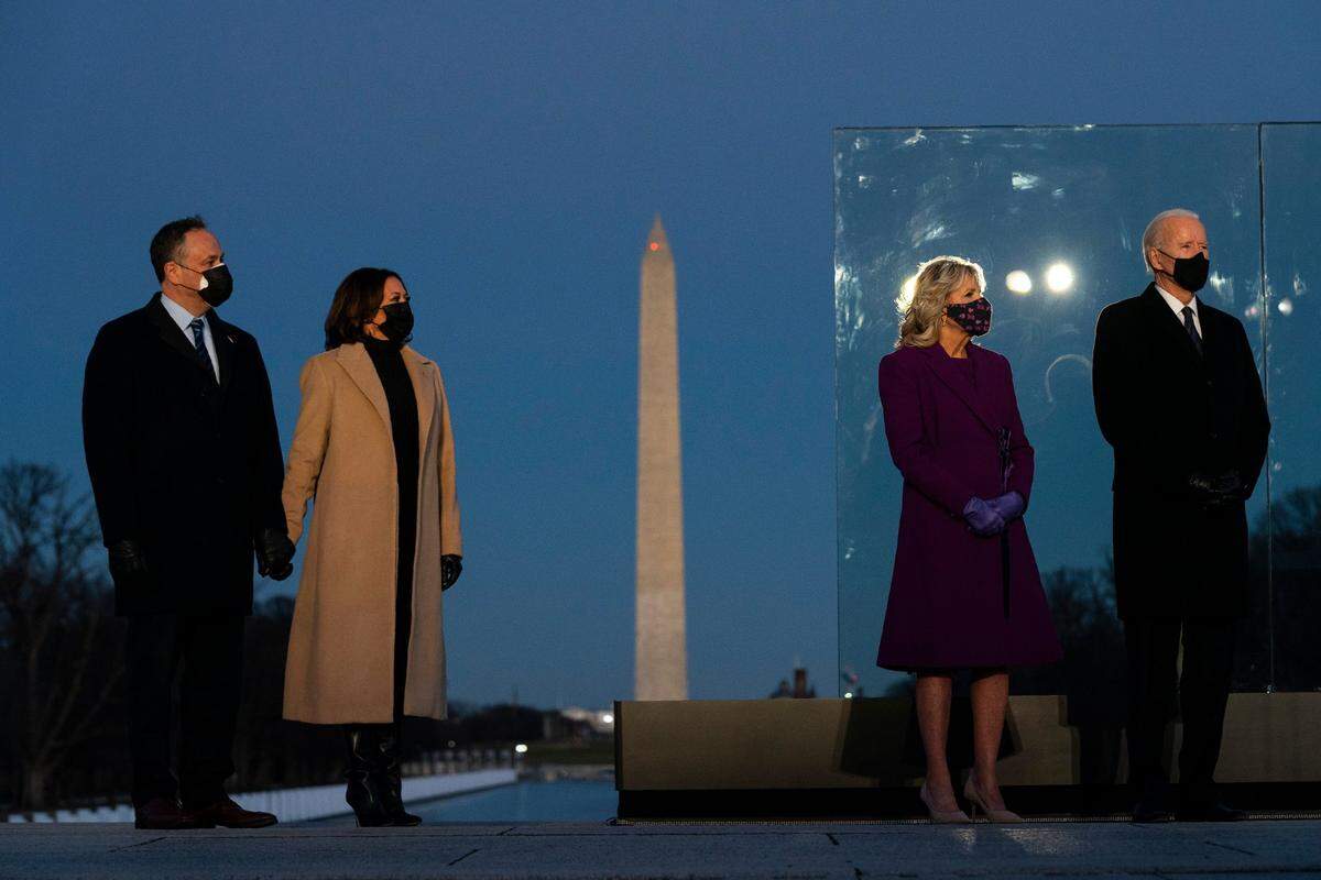 President-elect Joe Biden and his wife Jill Biden are joined by Vice President-elect Kamala Harris and her husband Doug Emhoff during a COVID-19 memorial event at the Lincoln Memorial Reflecting Pool, Tuesday, Jan. 19, 2021, in Washington.