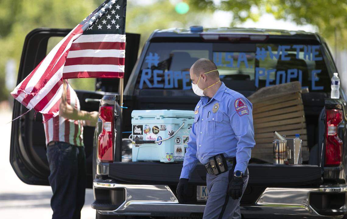 The last of several protestors is order to leave or be arrested on Jones Street on Tuesday, April 14, 2020 in Raleigh, N.C. Protestors gathered at the corner of N. Wilmington and Jones Street for nearly two hours calling on Governor Cooper to re-open the state due to economic concerns related to his stay at home order in the wake of the COVID-19 virus.