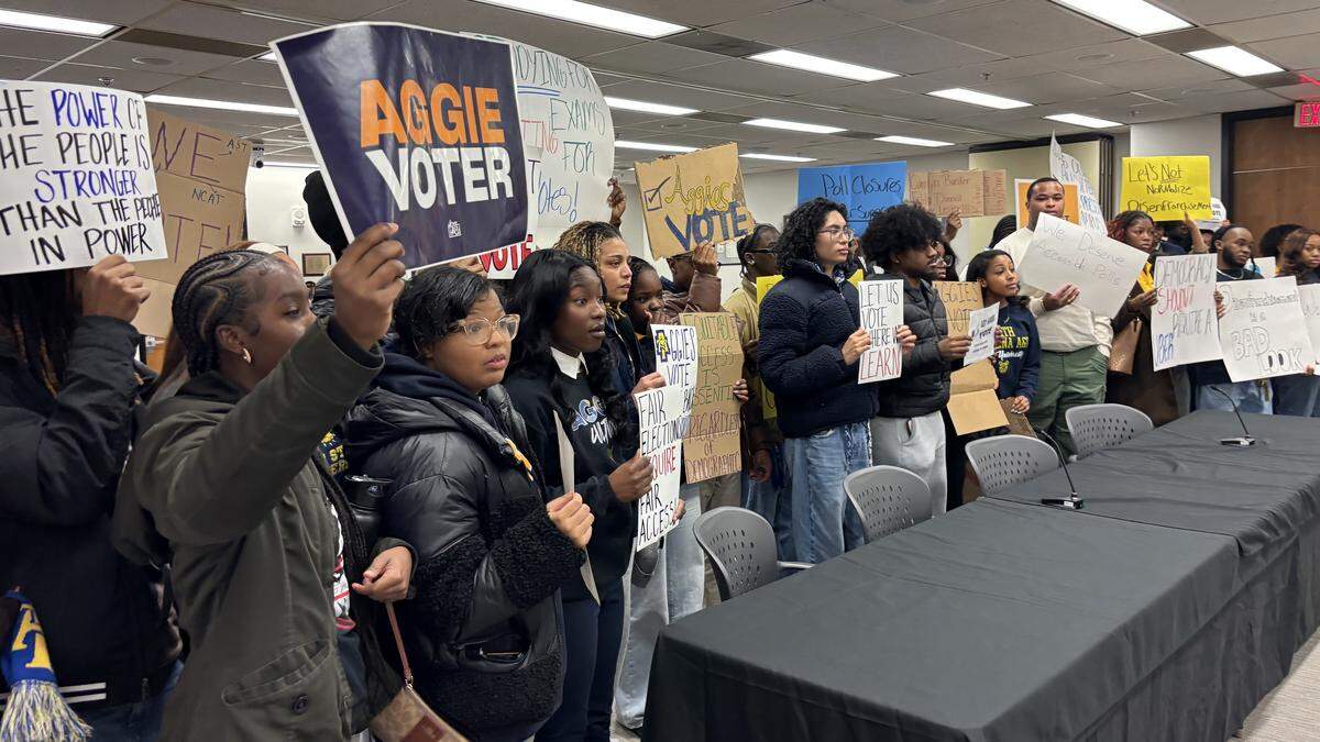 Students from North Carolina A&T State University confront members of the State Board of Elections after the Republican majority voted not to add an early voting site on their campus for the March primary election.