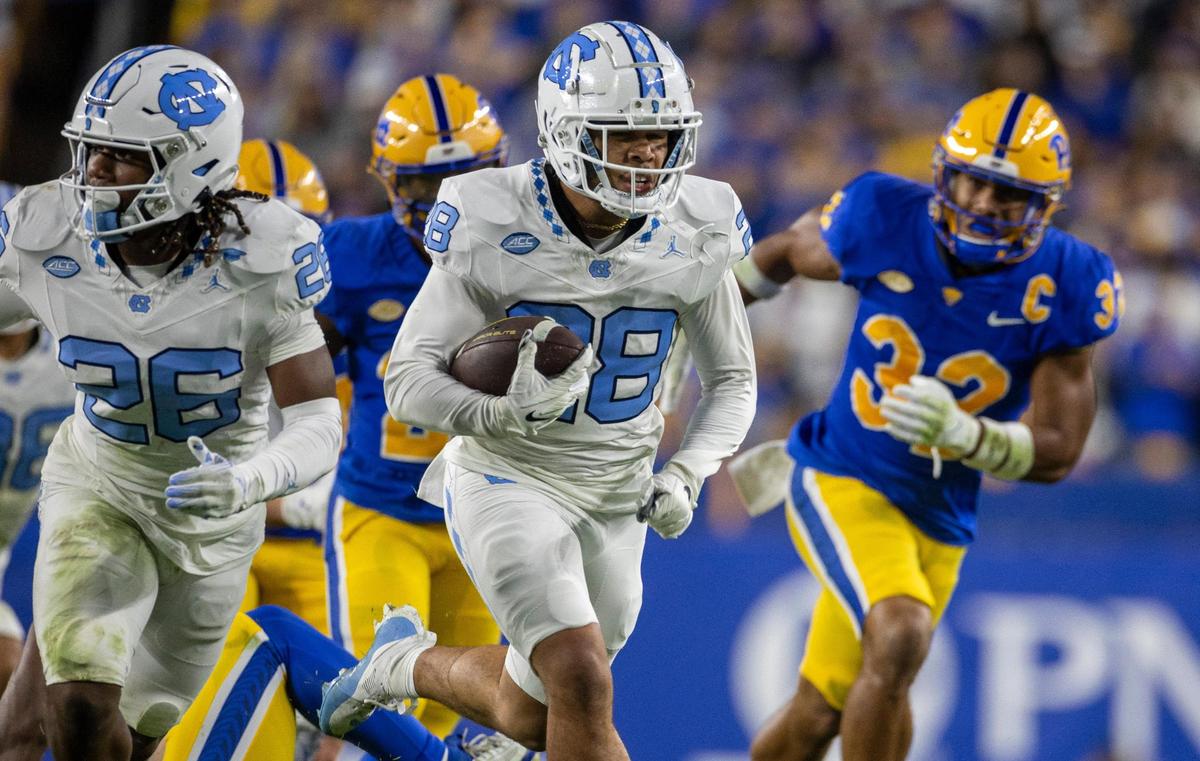 North Carolina’s Alijah Huzzie (28) returns a punt 52-yards for a touchdown in the second quarter to give the Tar Heels a 21-14 lead over Pitt in the second quarter on Saturday, September 23, 2023 at Acrisure Stadium in Pittsburgh, Pa.