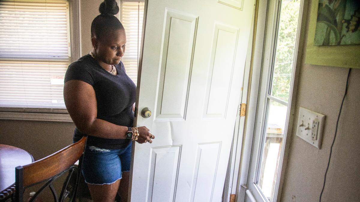 Shayla Tapp shows where Roxboro police rammed her door and raided her home in January. The raid occurred after Sgt. Alfred Cox responded to Ms. Tapp’s home and took possession of her dog. Police obtained a warrant after the officer claimed to smell marijuana at her residence.