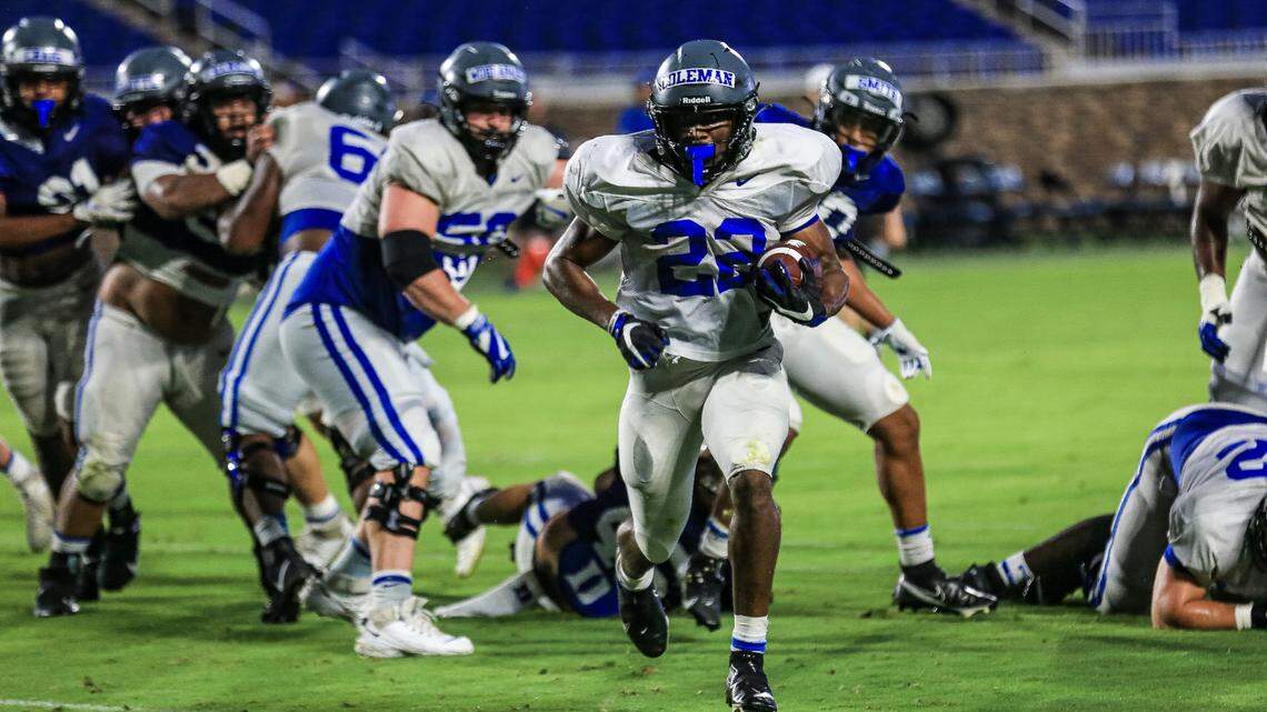 Duke running back Jaylen Coleman runs through the line during the team’s scrimmage Saturday night at Wallace Wade Stadium.