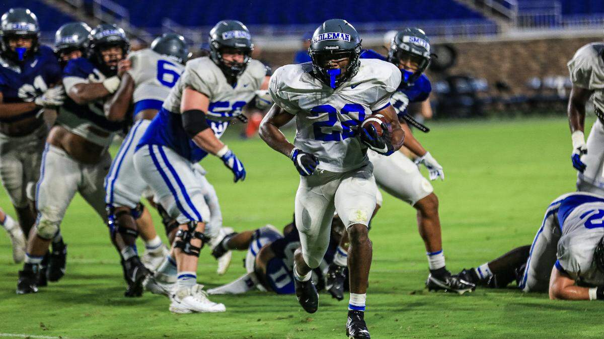 Duke running back Jaylen Coleman runs through the line during the team’s scrimmage Saturday night at Wallace Wade Stadium.