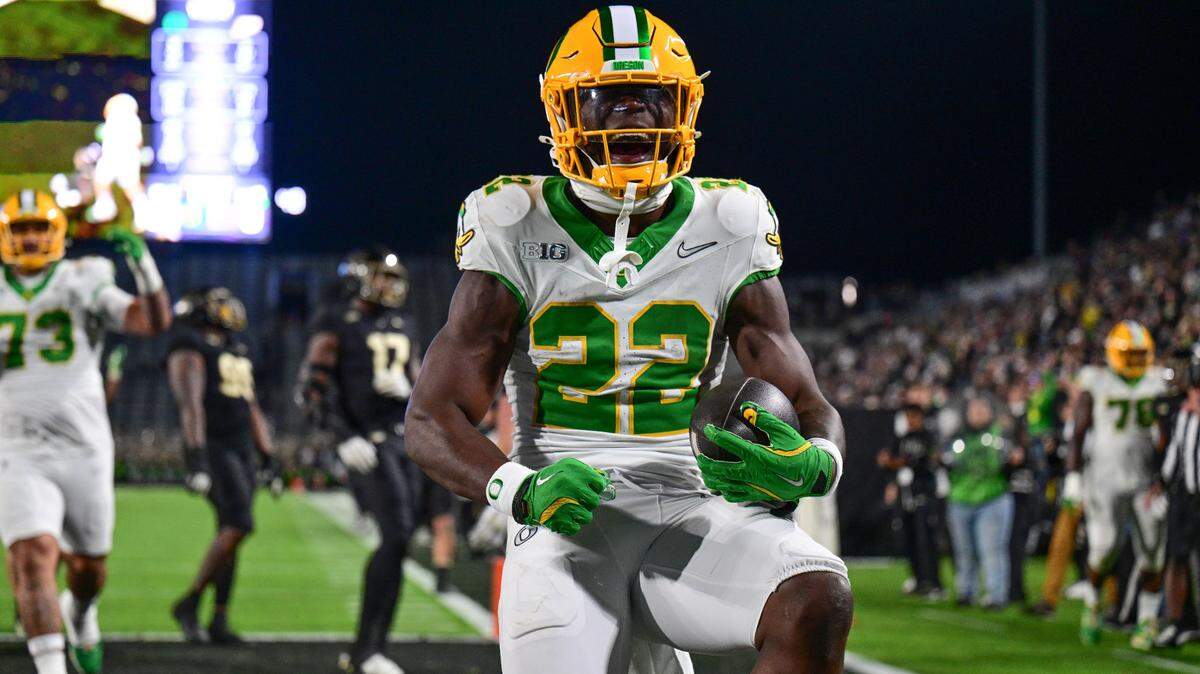 Oct 18, 2024; West Lafayette, Indiana, USA; Oregon Ducks running back Jay Harris (22) celebrates scoring a touchdown during the second half against the Purdue Boilermakers at Ross-Ade Stadium.